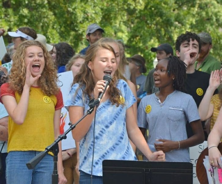 image of girls at climate strike rally