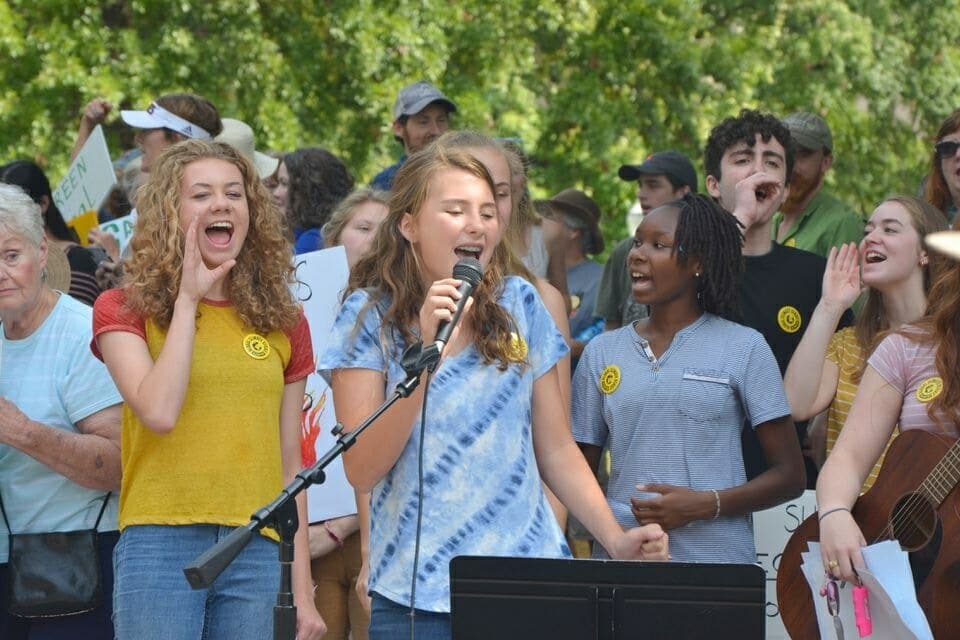 image of girls at climate strike rally