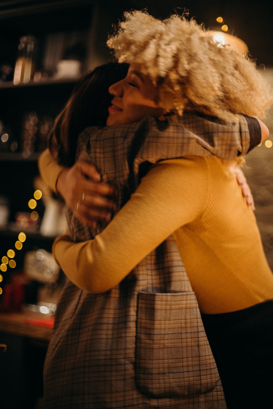 two people embrace in hugs