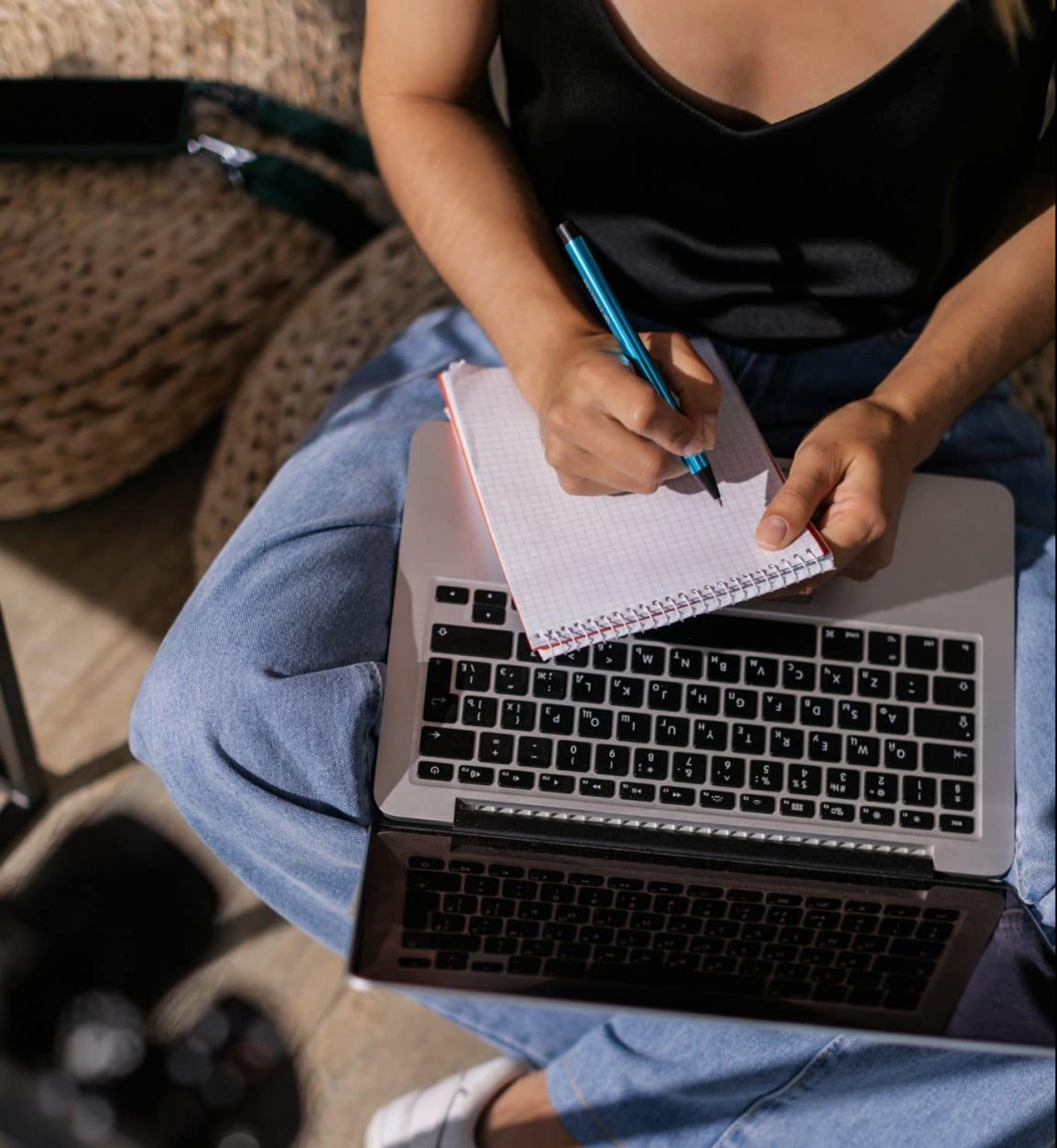 girl taking notes with laptop