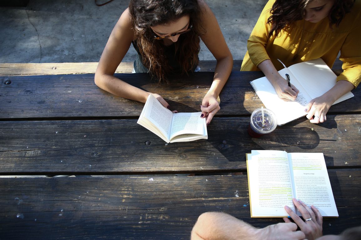 Girls Chatting and Studying