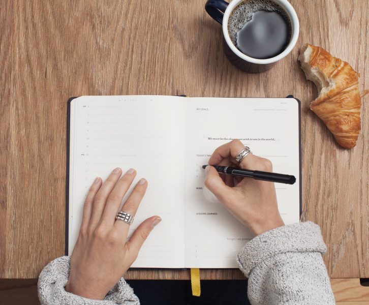 Girl writing in planner