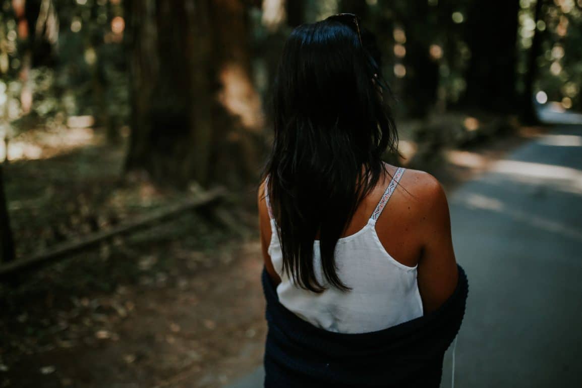 A woman wears a spaghetti strap top