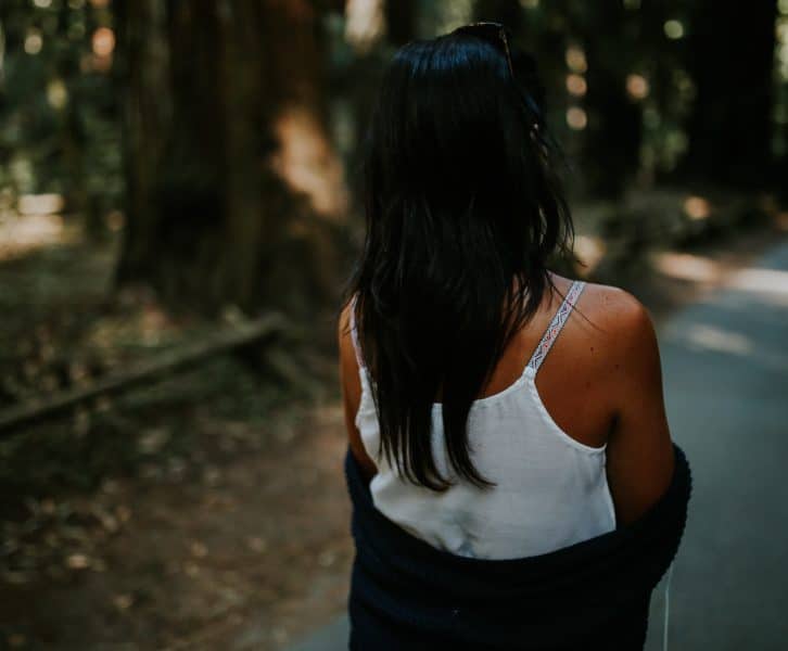 A woman wears a spaghetti strap top