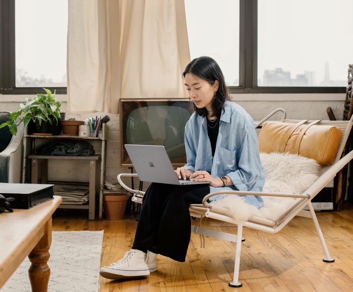 A woman works on her laptop