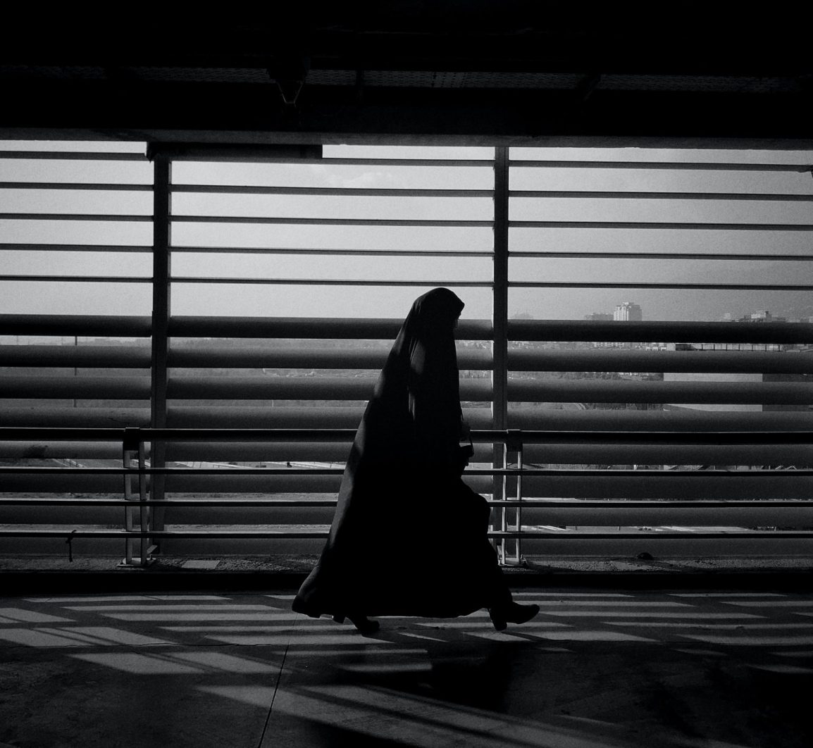 A woman walking in Tehran, Iran