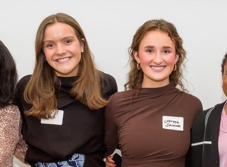 Photo of four young women smiling and standing together in a group, with a sign above them that reads "Meet the Springboarders." The image is related to a Teen Advisory Board.