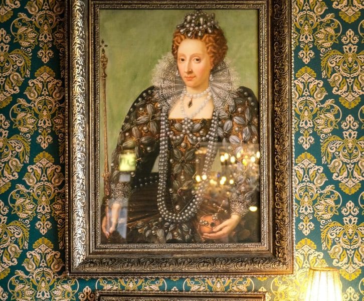 This is the portrait of a Tudor Queen in ornate historical clothing (dress)